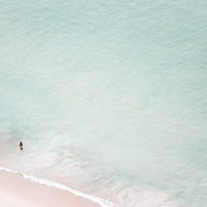 The Black Bikini woman in the sea enjoying the beach Aerial Photography
