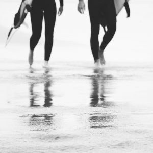 Two surfers walking by the seaside: Catch a Wave V